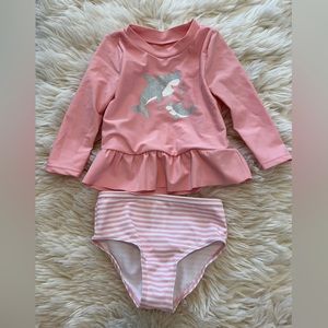 Carter’s pink long sleeve rash guard with dolphins and striped bottom, 9M